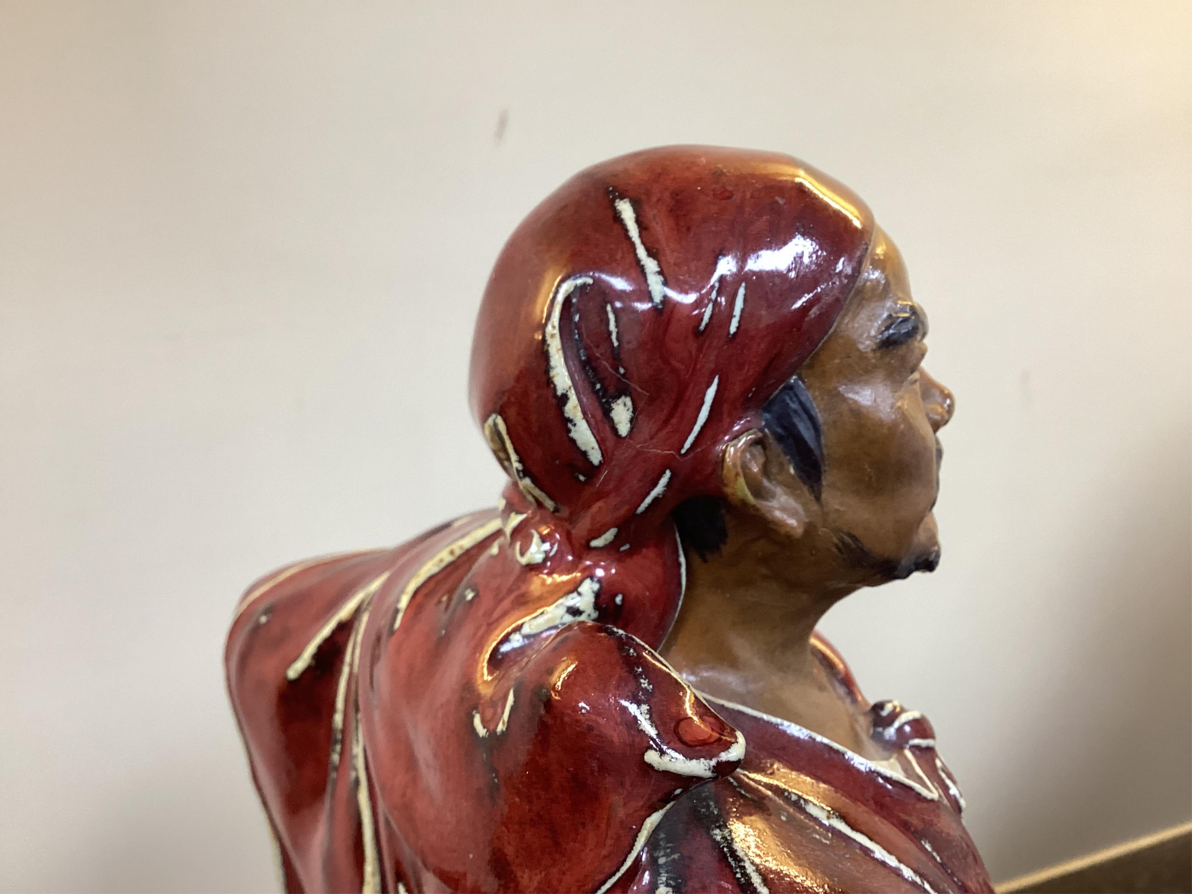 A large Chinese Shiwan stoneware figure of a warrior, 20th century